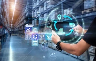 Warehouse manager reviewing screens with limited insights, showing how logistics video analytics solves lack of actionable data.